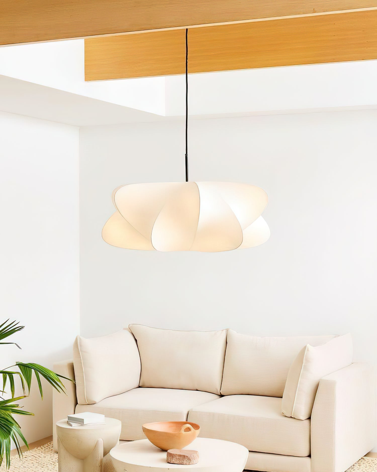 Cloud-shaped silk pendant light in a bright minimalist space