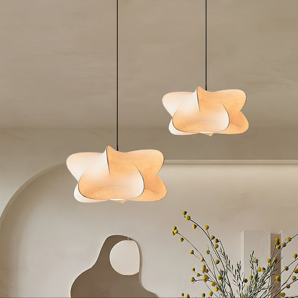 Silk strand pendant light glowing softly in an evening room