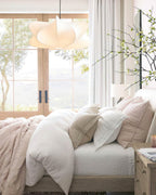 Elysia pendant light with its silk shade seen from below
