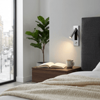 Recessed bedside wall sconce mounted flush with head folded in