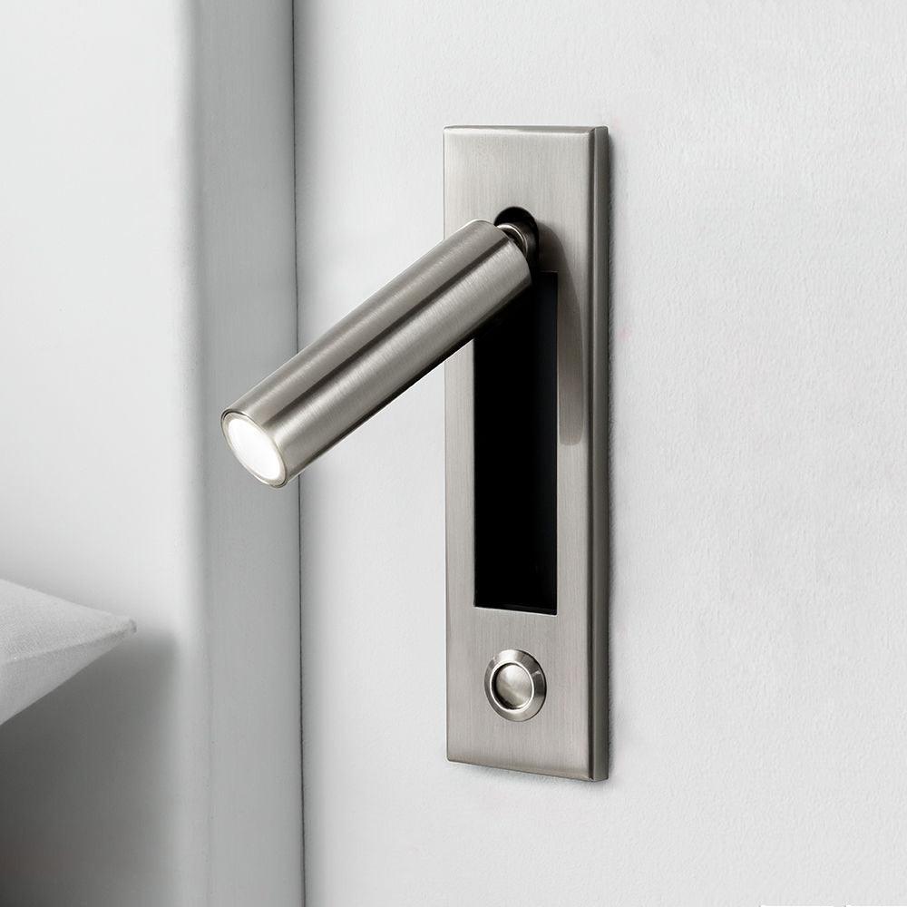 Embedded bedside sconce with adjustable head in a dark finish