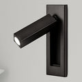 Recessed bedside wall sconce folded out as a reading light above a bed
