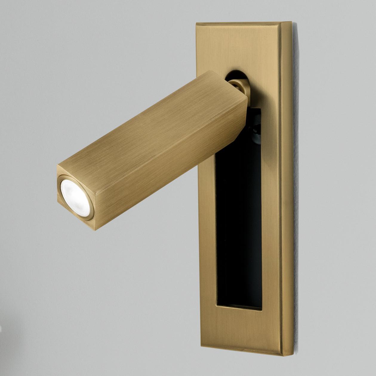 Recessed reading wall light mounted flush in a modern bedroom wall