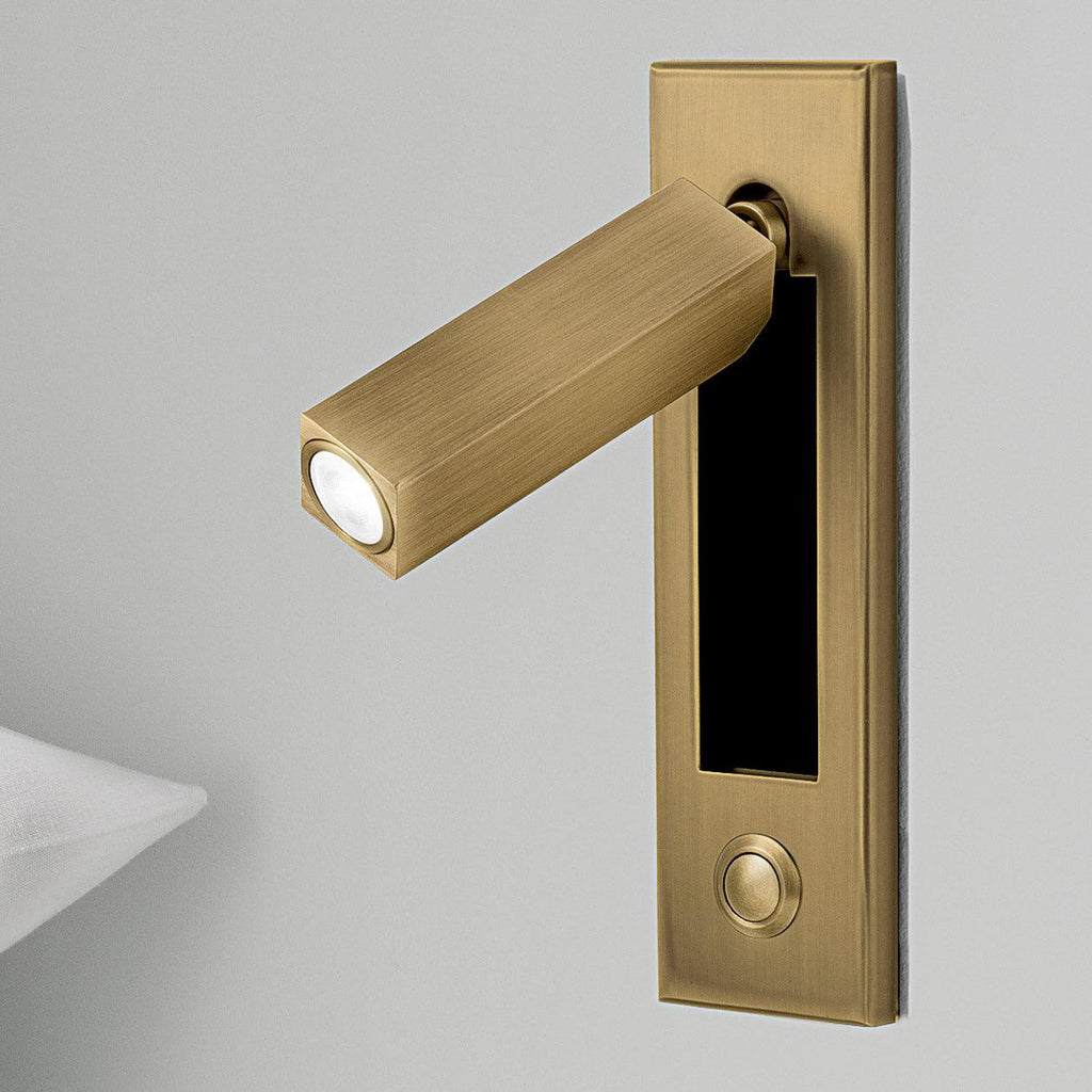 Recessed reading wall light flush-mounted in a minimalist interior