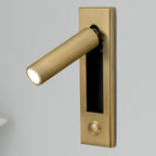 Recessed reading wall light beside a bed in a modern bedroom