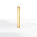Mid-length Kristy alabaster wall lamp with brass frame, lit, side-angled white studio view.