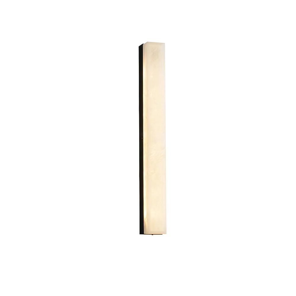 Long, narrow black-framed Kristy wall lamp lit and angled on a white studio background.