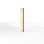 Kristy linear alabaster wall lamp with a black side frame, shortest size, lit on a white backdrop.