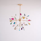 Agate chandelier glowing warmly against a neutral wall