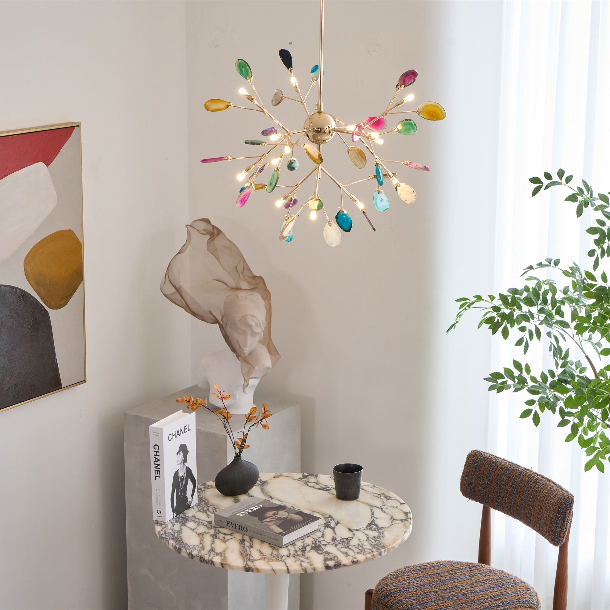 Agate slices and rose gold arms on a lit chandelier