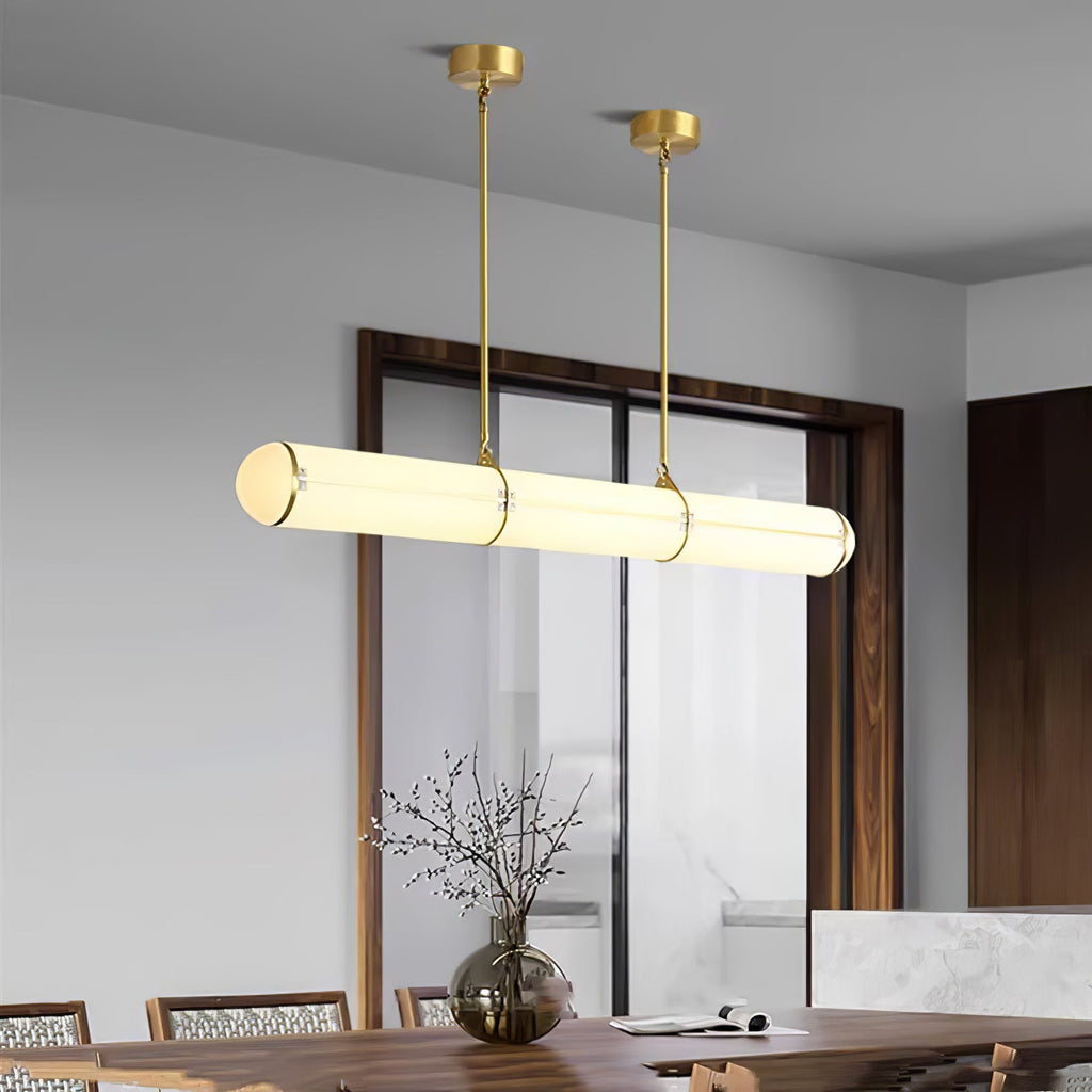 Linear pendant light shown over a long table