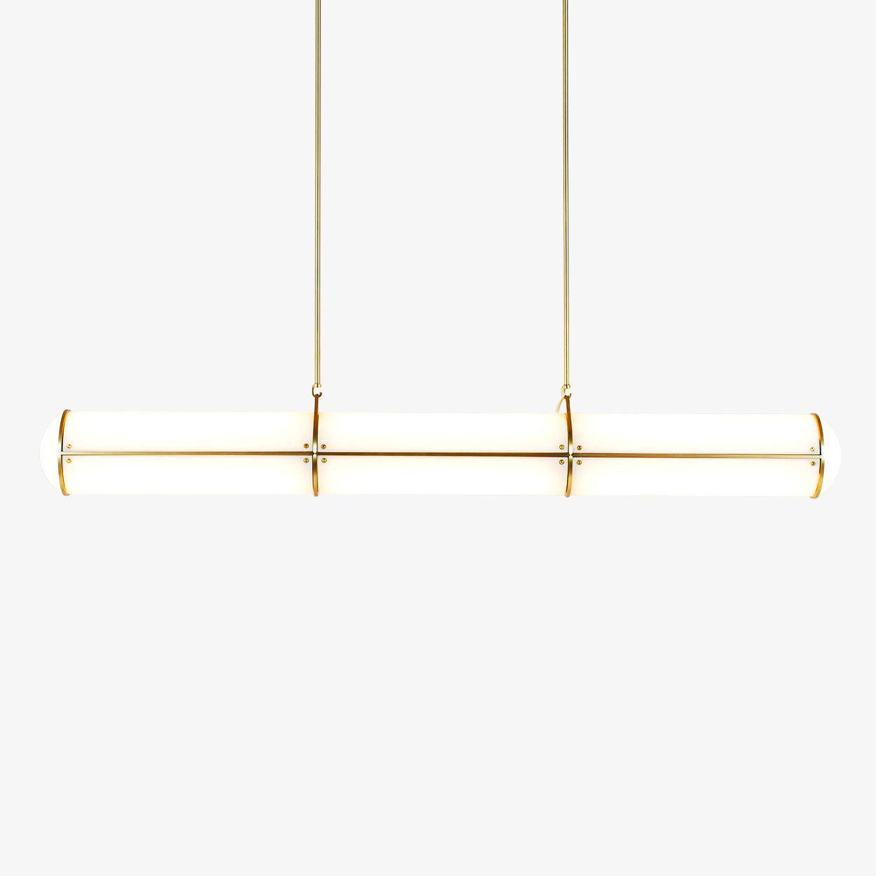 Cylindrical linear pendant light shown lit above a table