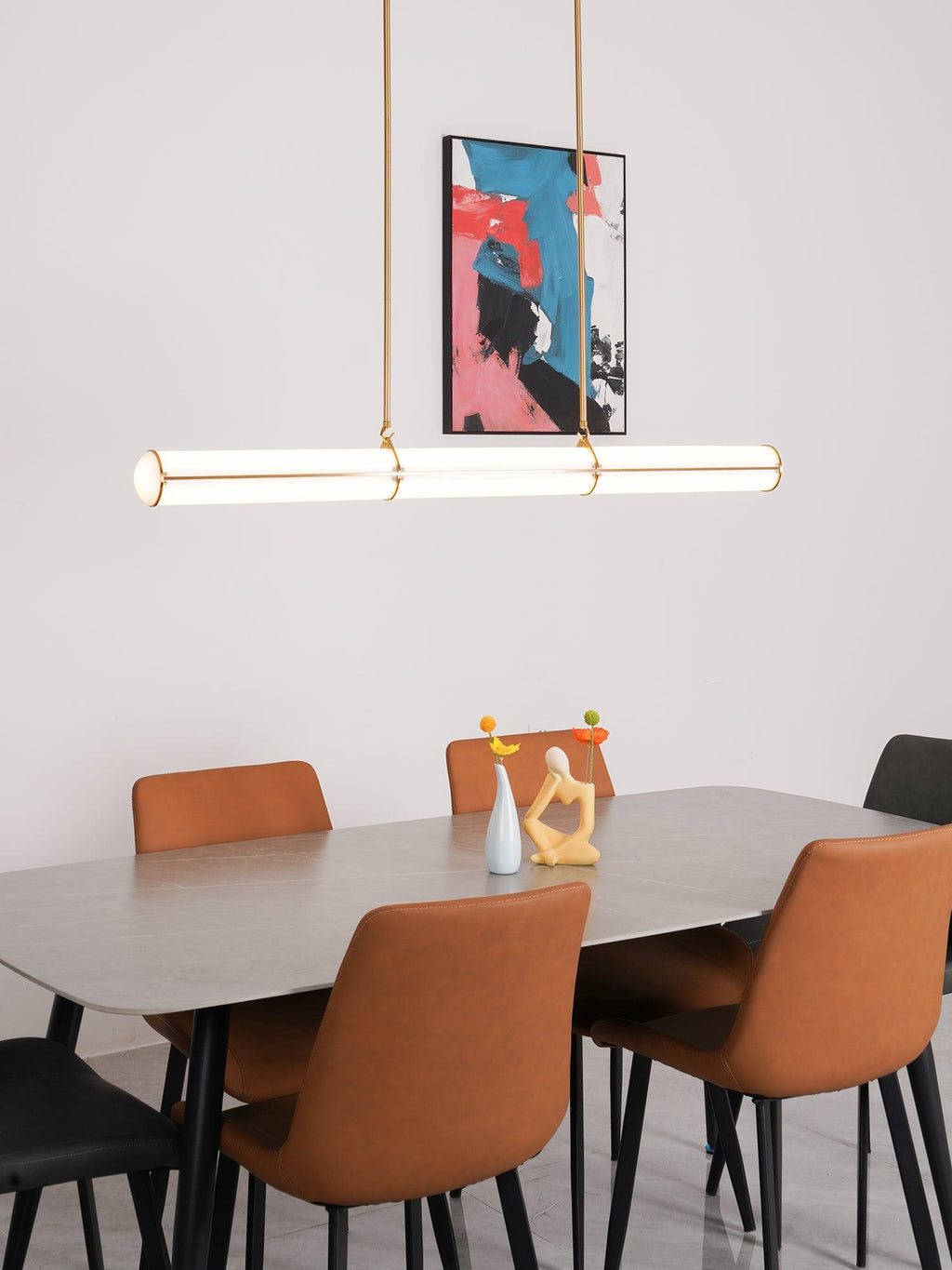 Linear pendant light glowing in a styled interior