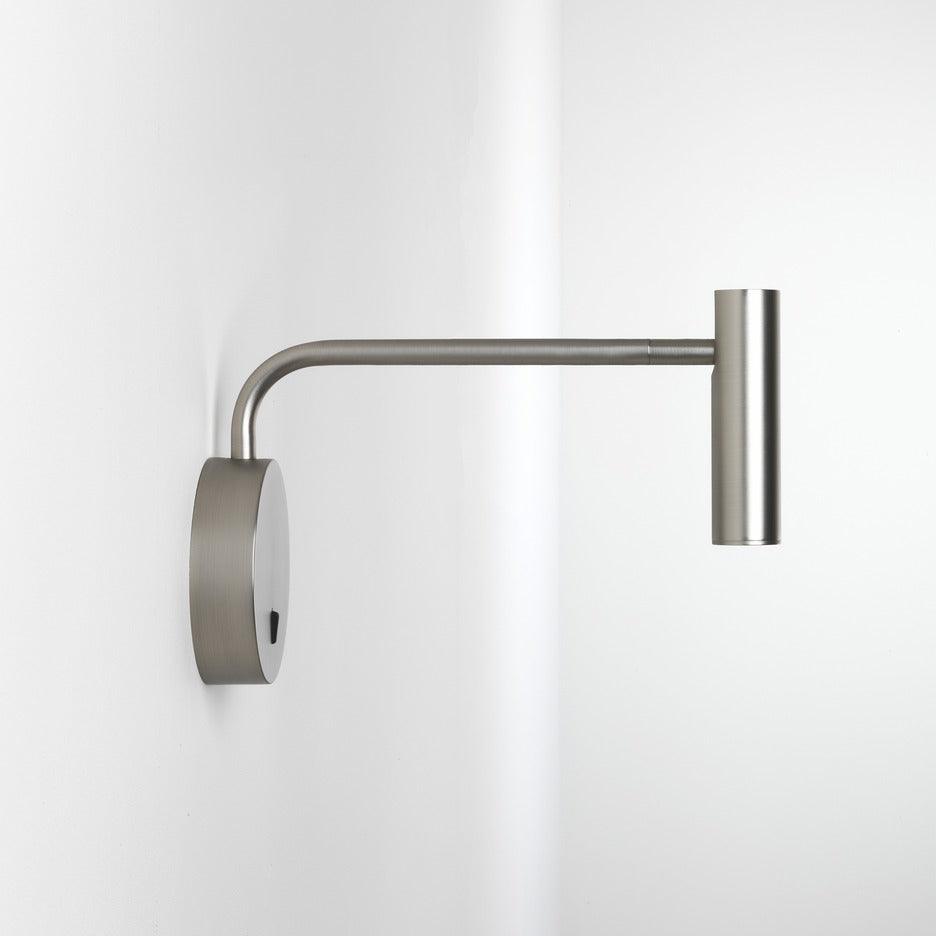 With its arm fully extended, this sand nickel Clérachic wall sconce is shown on a plain white backdrop.