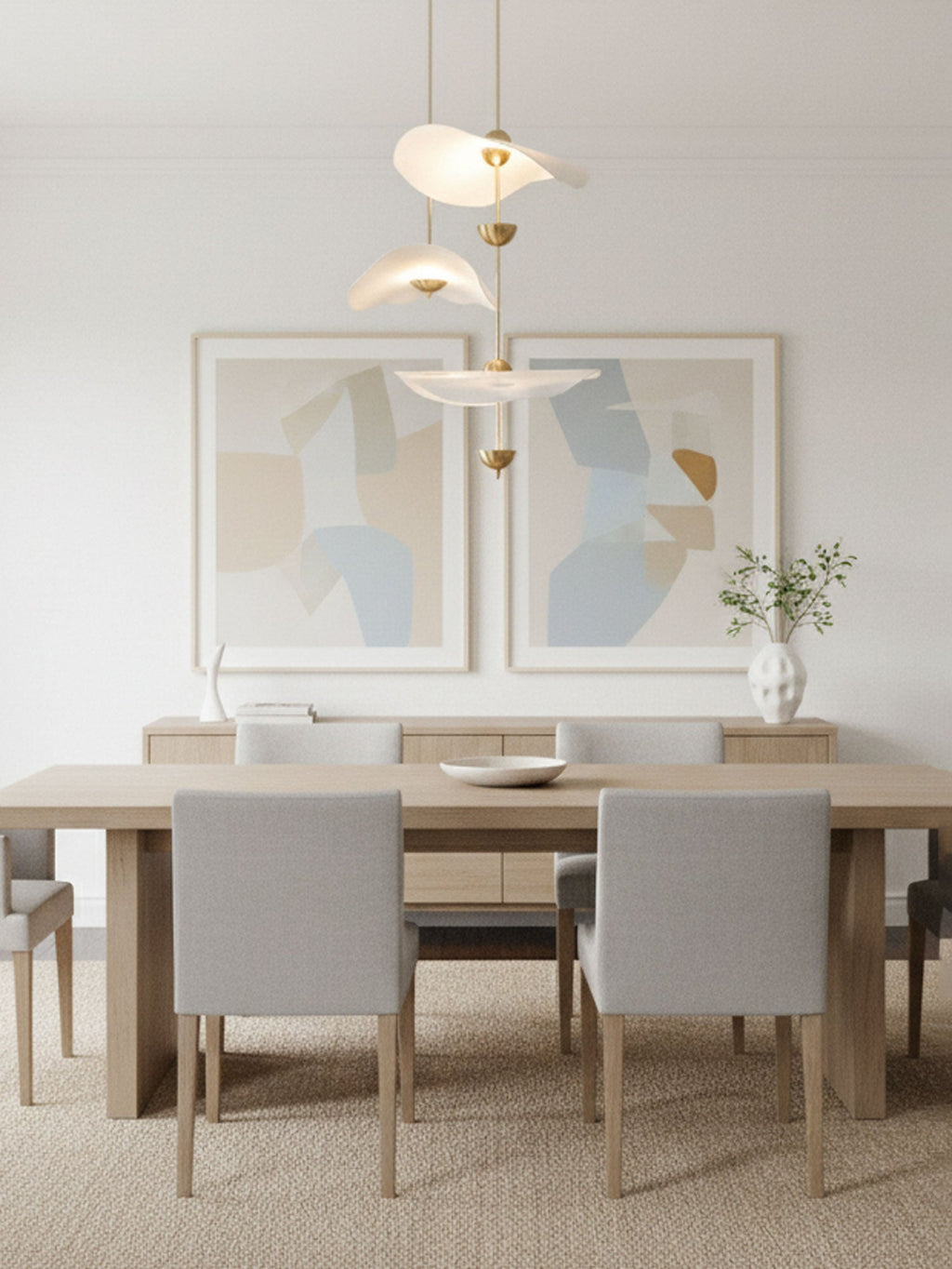 Close detail of the Envolee Double Biscuit pendant's layered white shade and gold frame