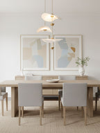 Close detail of the Envolee Double Biscuit pendant's layered white shade and gold frame