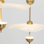 Envolee Double Biscuit pendant light in gold and white hanging above a styled dining table
