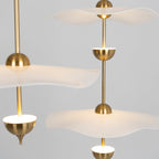 Envolee Double Biscuit pendant light casting soft warm light in a modern room