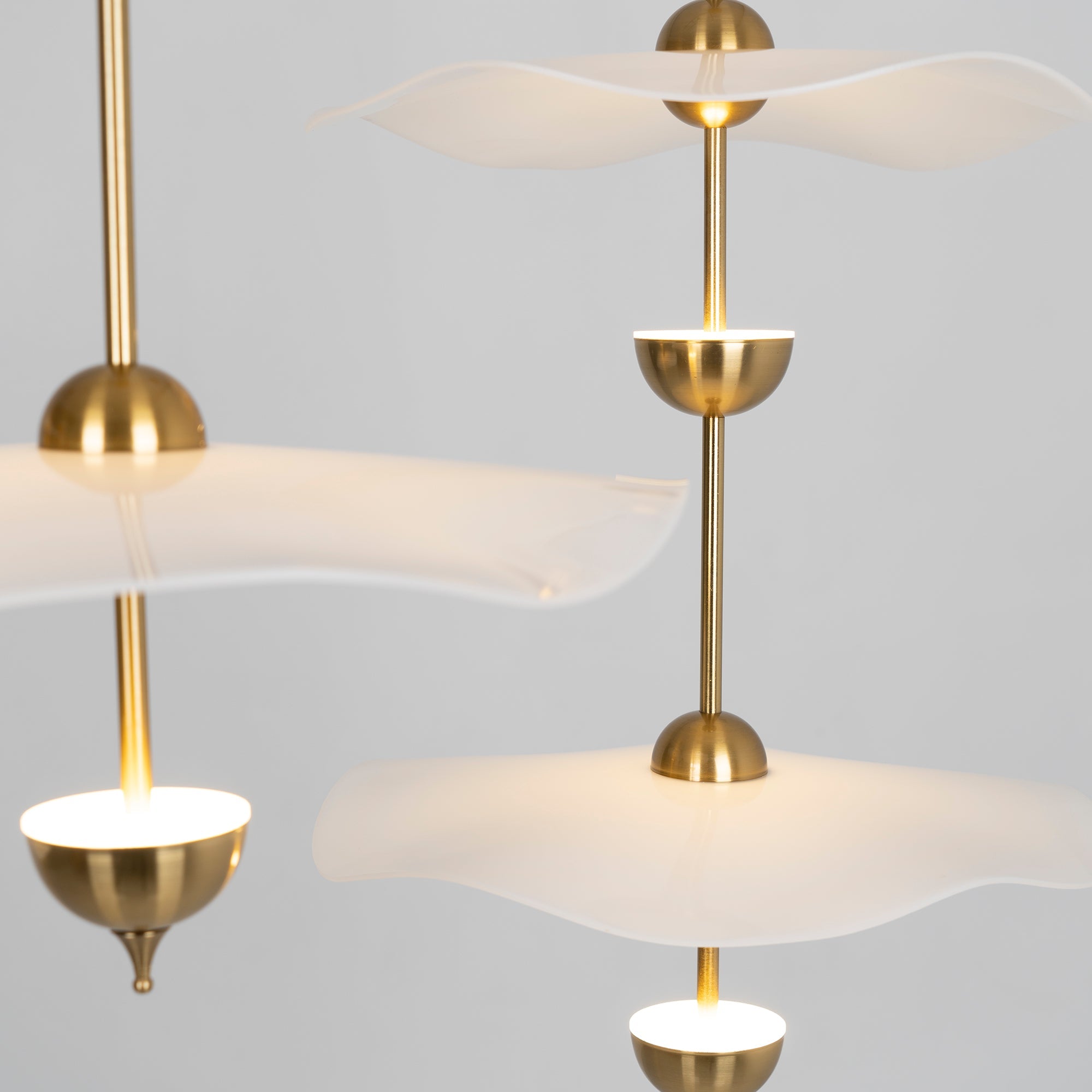 Envolee Double Biscuit pendant light casting soft warm light in a modern room