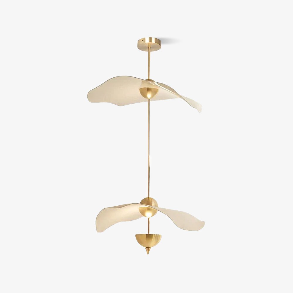 Envolee Double Biscuit gold and white pendant light glowing warmly over a living space