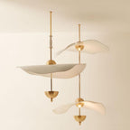 Close detail of the Envolee Double Biscuit pendant's layered white shade and gold frame