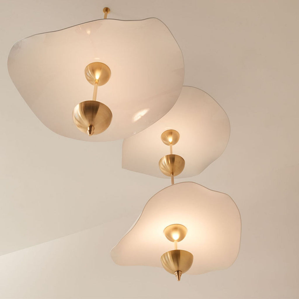 Envolee Double Biscuit pendant light in gold and white hanging above a styled dining table