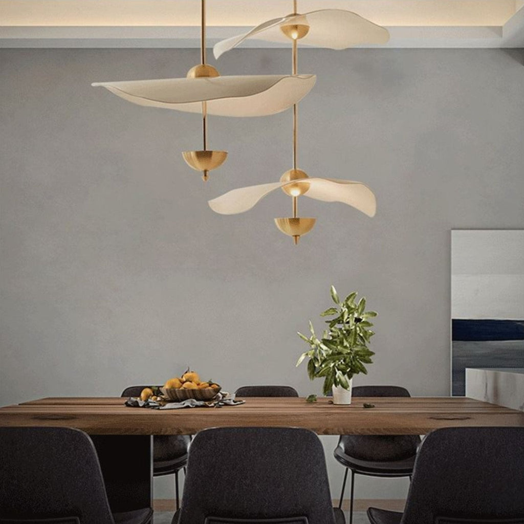 Side profile of the Envolee Double Biscuit pendant showing its sculptural double-shade silhouette