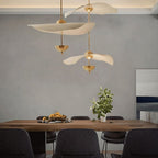 Side profile of the Envolee Double Biscuit pendant showing its sculptural double-shade silhouette