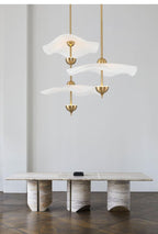 Envolee Double Biscuit gold-bodied pendant light suspended from an adjustable rod