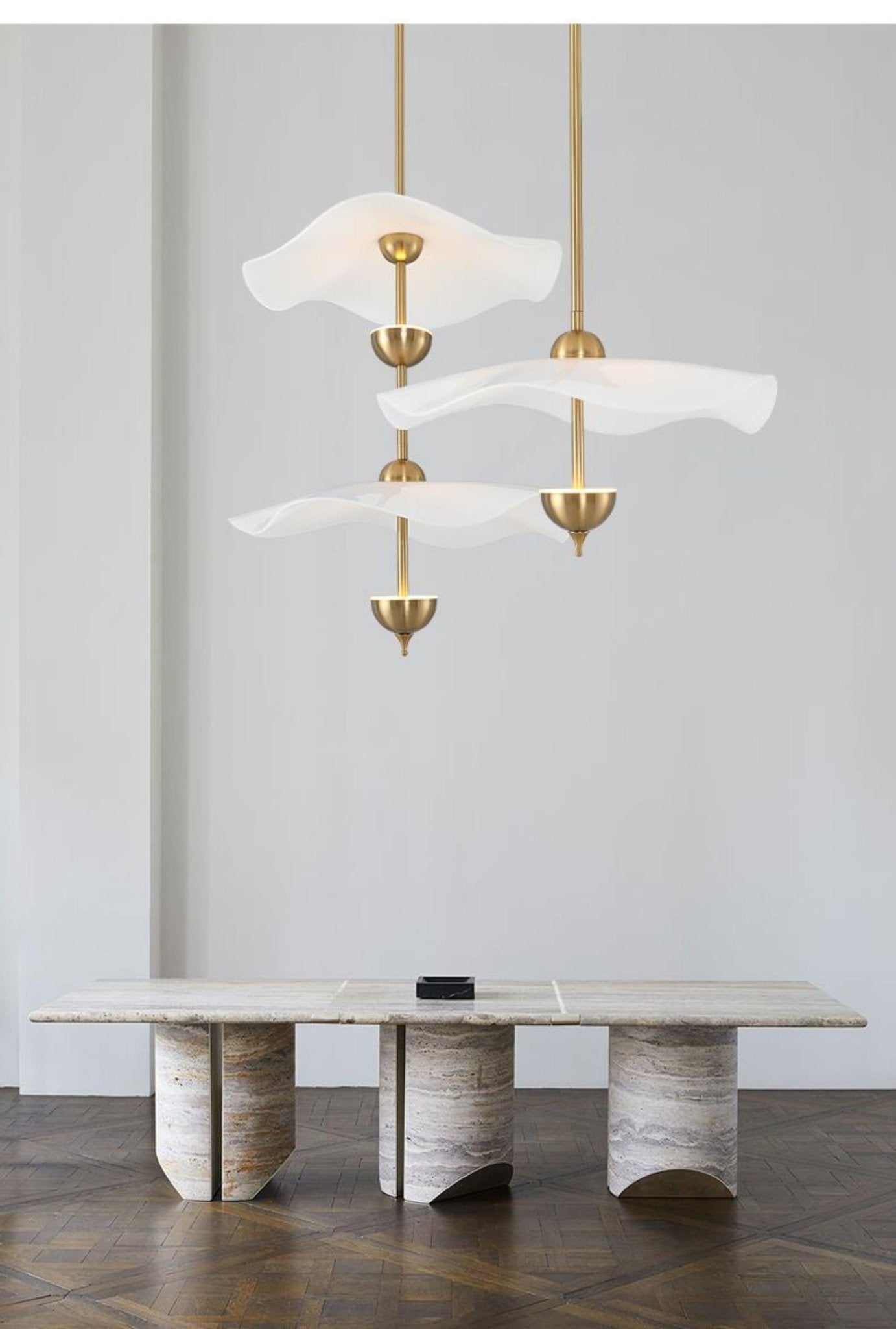 Envolee Double Biscuit gold-bodied pendant light suspended from an adjustable rod
