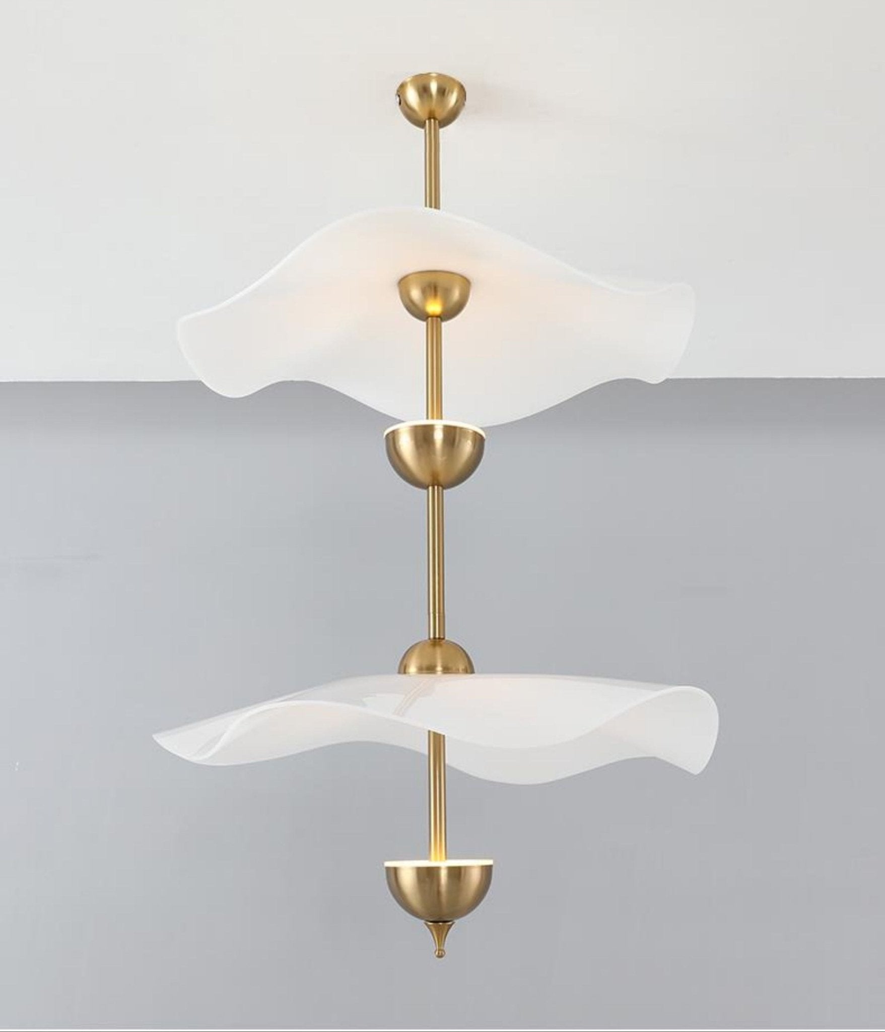 Envolee Double Biscuit pendant light casting soft warm light in a modern room