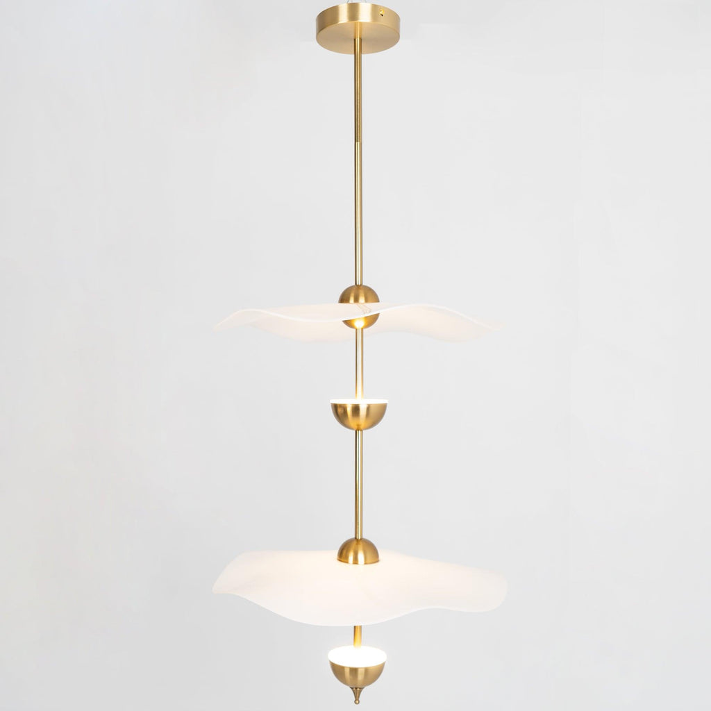 Envolee Double Biscuit pendant light in gold and white hanging above a styled dining table