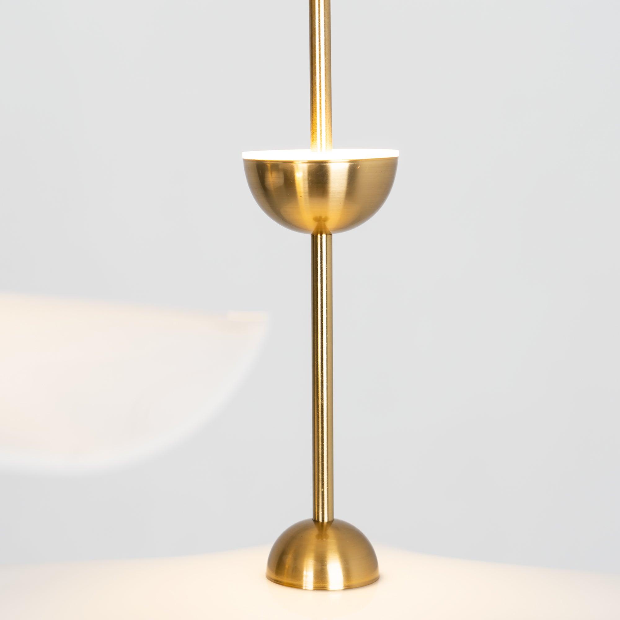 Envolee Double Biscuit pendant light in gold and white hanging above a styled dining table