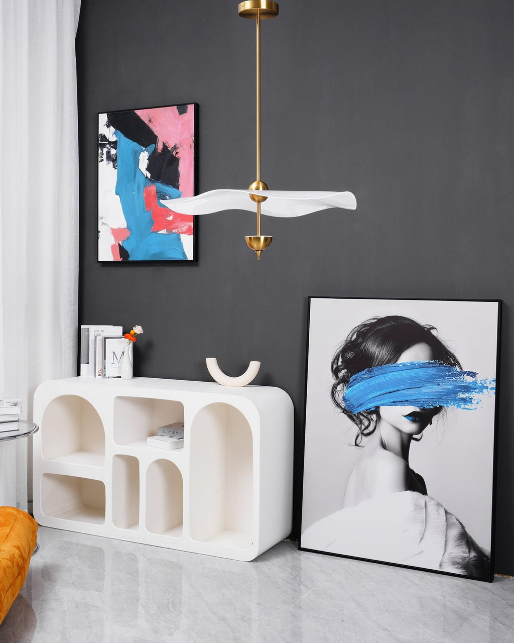 Envolee Double Biscuit gold-bodied pendant light suspended from an adjustable rod