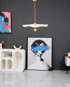 Envolee Double Biscuit pendant light in gold and white hanging above a styled dining table