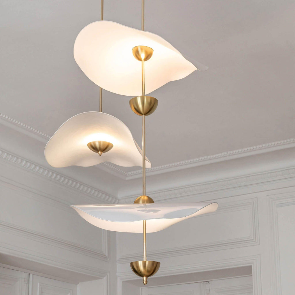 Envolee Double Biscuit pendant light in gold and white hanging above a styled dining table