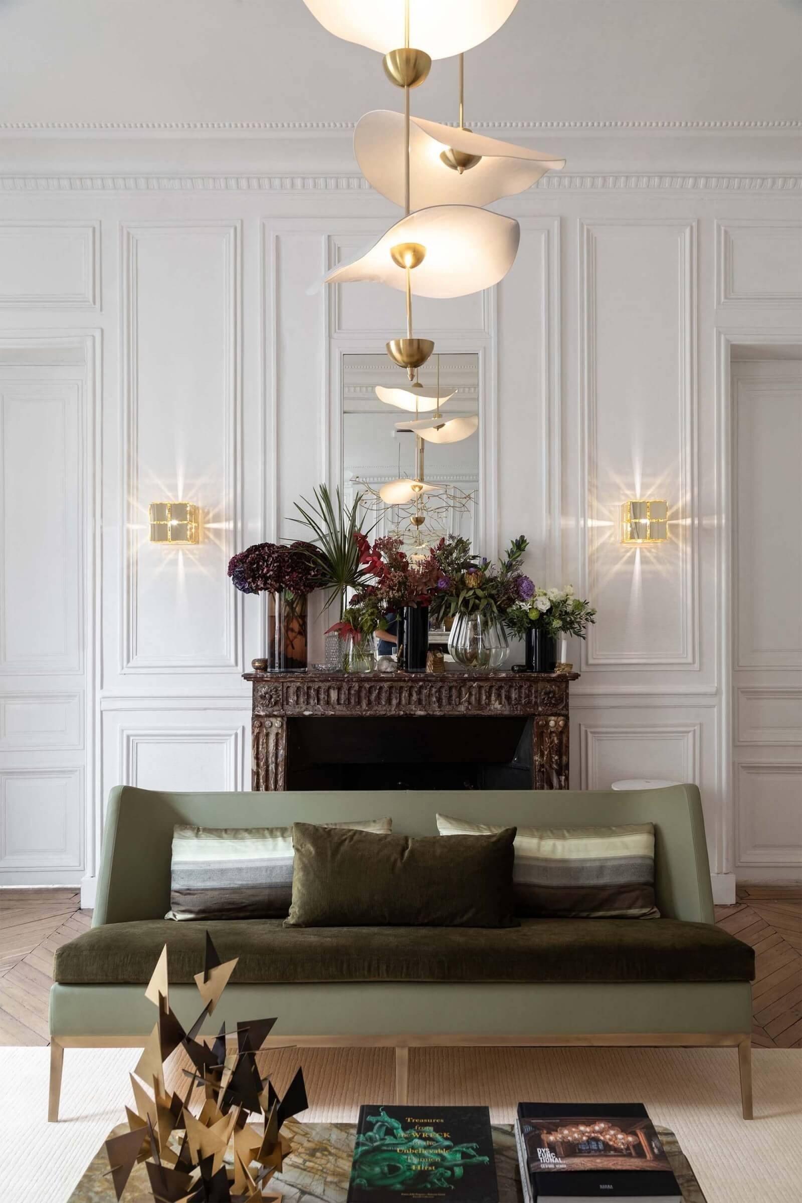 Envolee Double Biscuit gold-bodied pendant light suspended from an adjustable rod