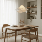 Ethereal Bloom pendant light angled view with gold body above the white shade