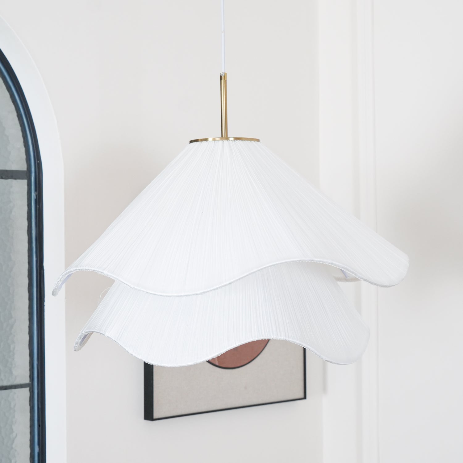 Ethereal Bloom pendant light styled overhead in a warm room setting