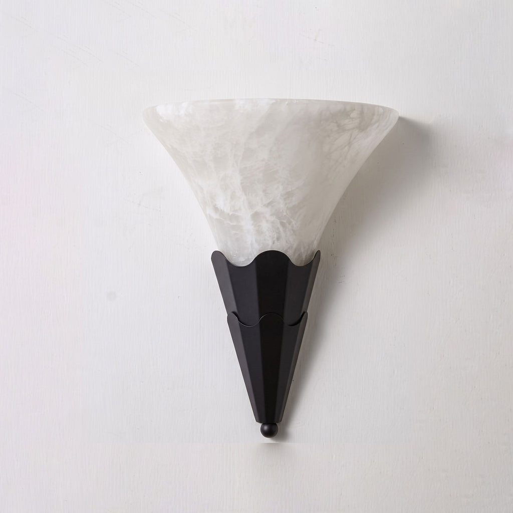 Against a plain white background, this Clérachic sconce's fan-shaped alabaster shade tops a matte black fluted base.