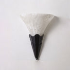 Against a plain white background, this Clérachic sconce's fan-shaped alabaster shade tops a matte black fluted base.