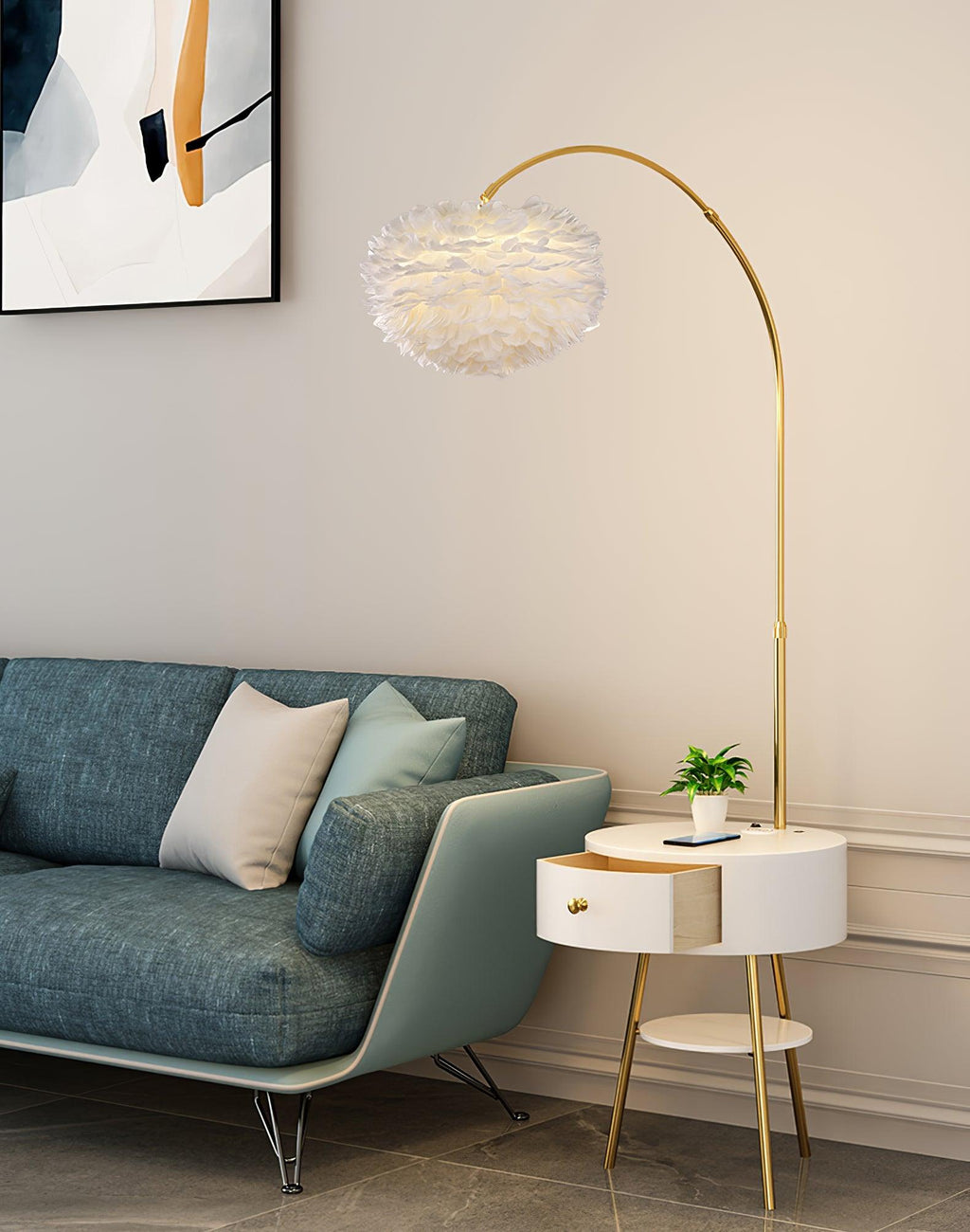 In a living room corner, this Clérachic gold arc lamp arches its feather shade over a teal sofa, the marble side table tucked beside it.