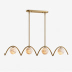 Shown alone against a plain backdrop, the wave-tube arches of this Clérachic chandelier appear in brushed brass.