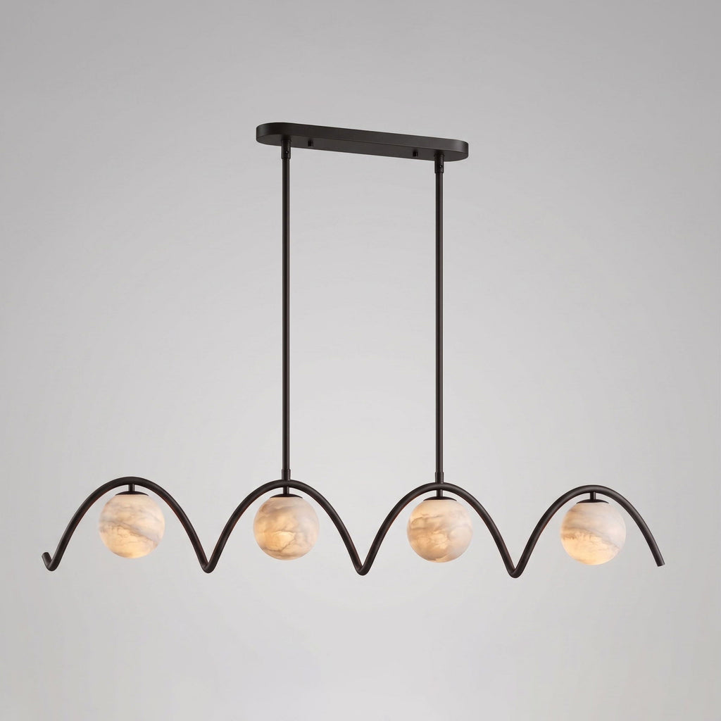 Against a plain grey backdrop, this Clérachic chandelier's four arched tubes and ball shades sit in matte black.