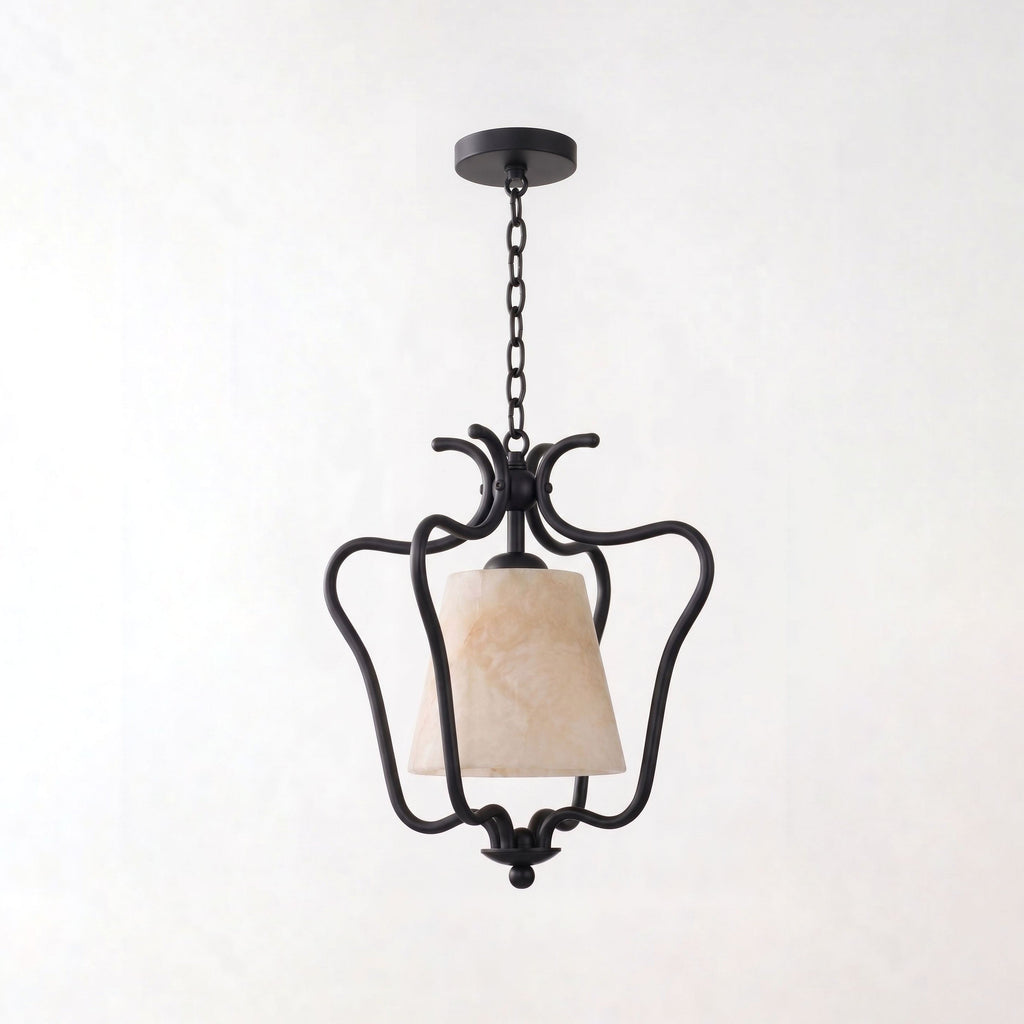 Set against a plain white background, the matte black finish of this Clérachic pendant scrolls into an open lantern frame.