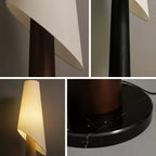 A four-part detail view of the Clérachic floor lamp: the angled shade, its wood-grain body and round marble base.