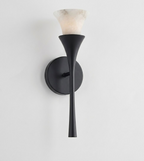 Lit against a plain white background, this Clérachic sconce's alabaster shade glows atop a matte black trumpet stem.