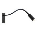 Gooseneck wall lamp with flexible arm mounted beside a reading nook