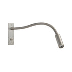 Gooseneck wall lamp with flexible arm mounted beside a reading nook