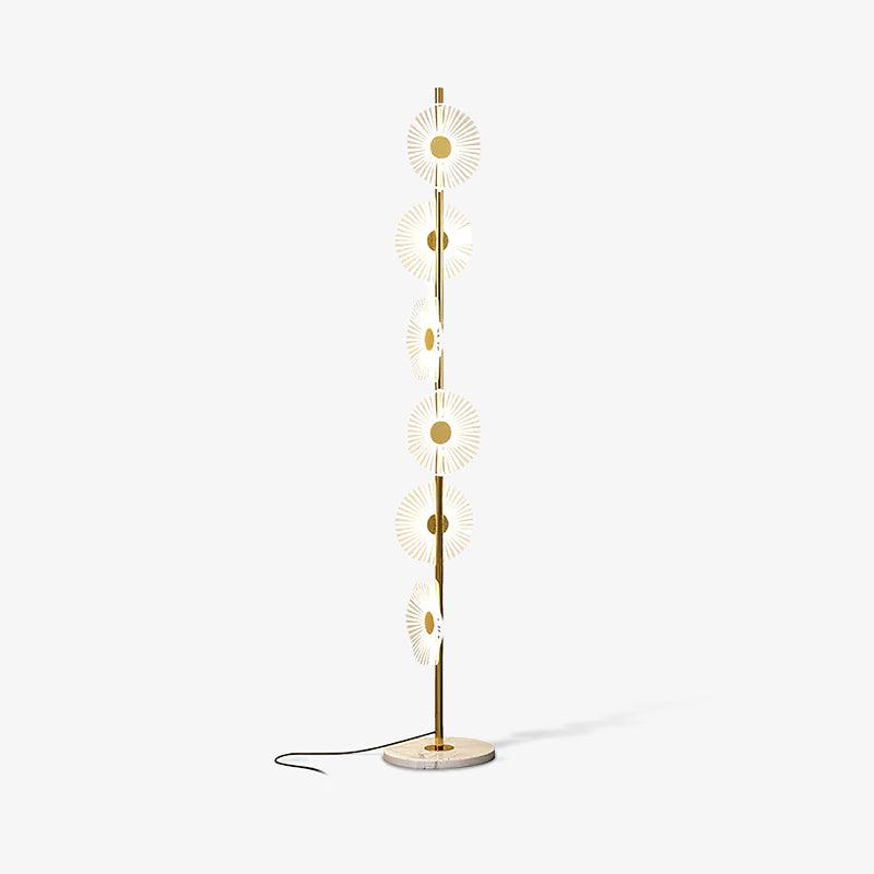 Lit and photographed alone on grey, this Clérachic floor lamp shows its cord curving loosely across the studio floor.